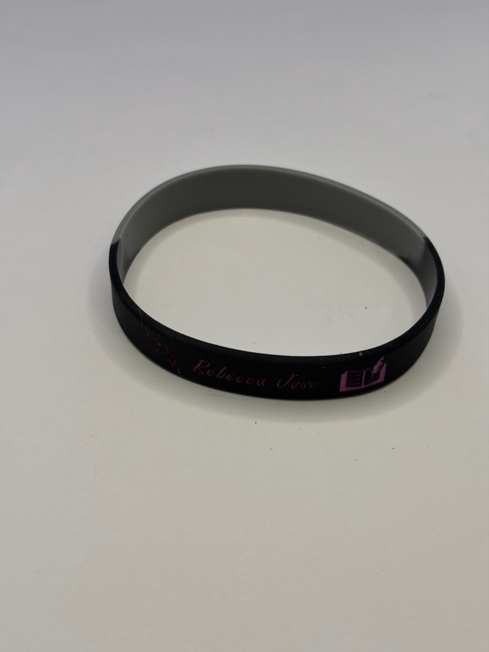 💜 5/$15 - Rebecca Jose Author Black Silicone Wristband - Pink Accent - Picture 2 of 5